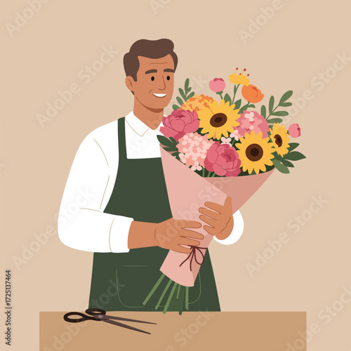Smiling florist holds colorful bouquet in pink wrap, scissors on table