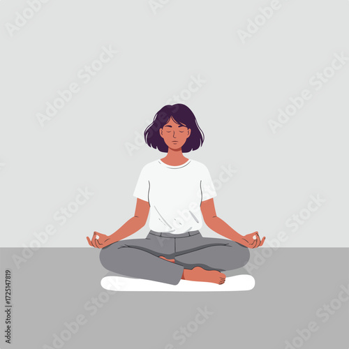 Meditating woman with closed eyes, seated in the lotus position on a cushion