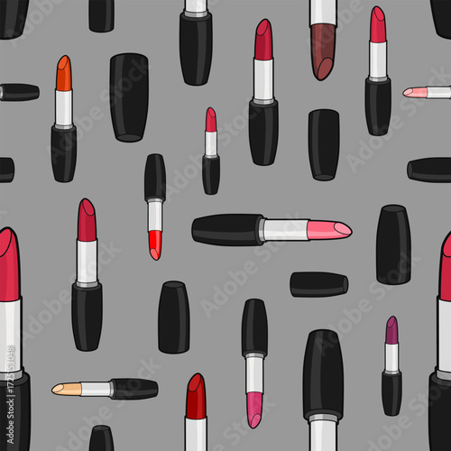 Vector seamless pattern with varicolored lipsticks and caps of different size rotated in different directions on gray background
