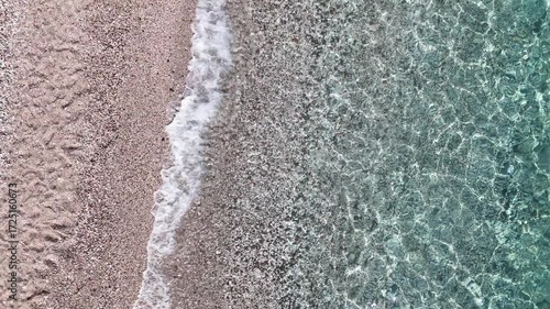 Aerial drone footage of Cala Sisine beach, Sardinia, Italy – turquoise sea and cliffs