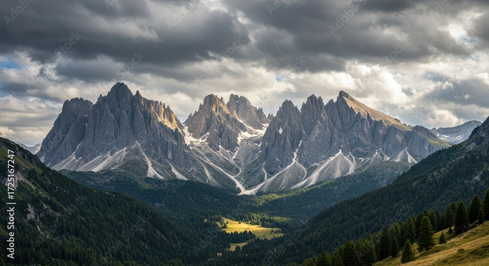 Fototapeta premium Dramatic mountain range with sharp peaks under a cloudy sky
