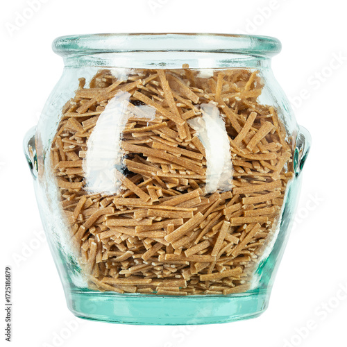 Glass jar filled raw pasta isolated on white background. File contains clipping path.