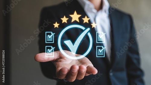 Business professional displays quality assurance rating stars and checkmarks on hand
