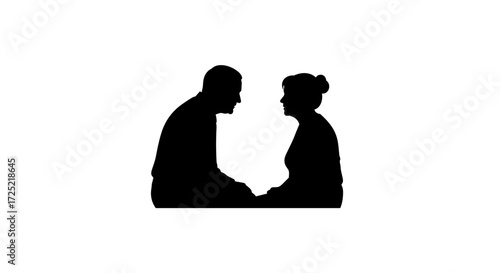 Elderly couple gazing at each other while holding hands in silhouette  