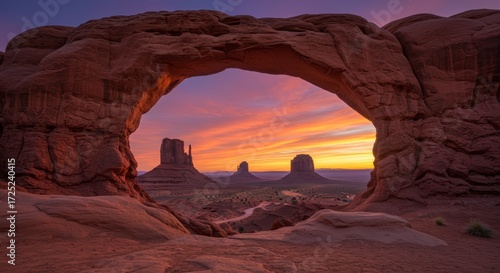 Sunrise through natural arch landscape view