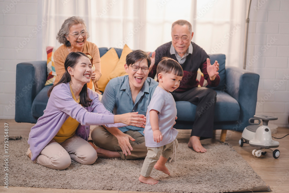 Φωτογραφία Happy multigenerational Asian family encouraging baby’s first steps at home, concept of family bonding, parenting, childhood milestone, grandparents love, togetherness, joy, and supportive lifestyle