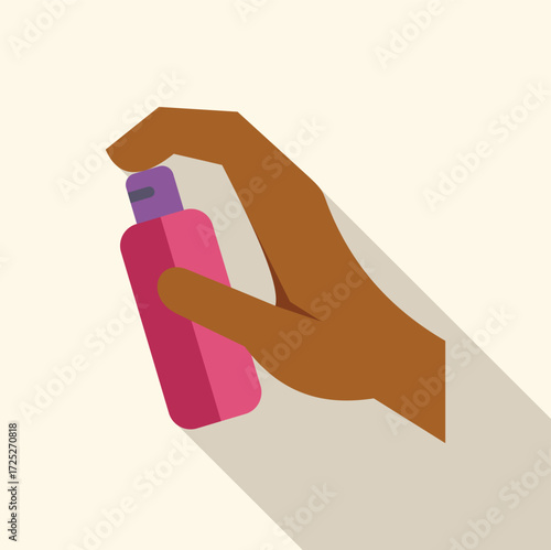 Hand is holding and pressing a pink spray can with a purple lid, potentially indicating the use of cosmetics, fragrance, or other similar products