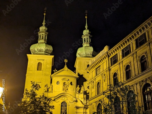 Illuminated Baroque Church Towers in Prague at Night