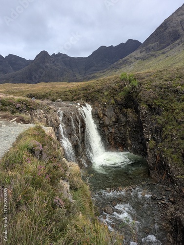 Waterfall at the Fairy Pools with Black Cuillin peaks in the background on the Isle of Skye Scotland