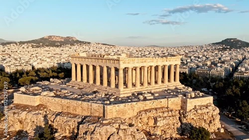 Aerial view of the parthenon in athens, greece, showcasing the ancient temple and the cityscape during a golden hour, highlighting the historical architecture