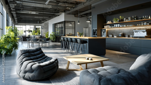 Stylish office lounge and kitchen area with comfortable seating, a modern design and industrial details. Spacious and inviting.
