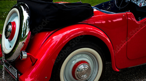 Photos Detail of rear fender and spare tire on vintage red convertible
