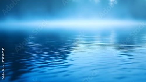 A serene, tranquil scene of still water reflecting a hazy, misty sky, showcasing a soft, cool blue color palette.