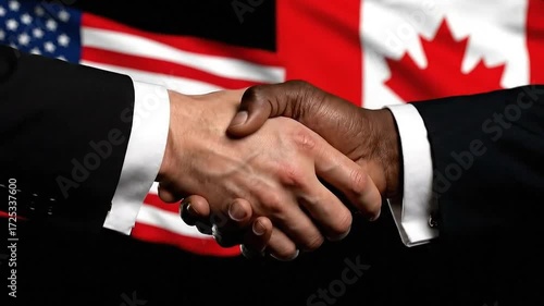 Two hands shaking in agreement with American and Canadian flags in background, symbolizing international cooperation and partnership.