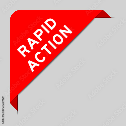 Red color of corner label banner with word rapid action on gray background