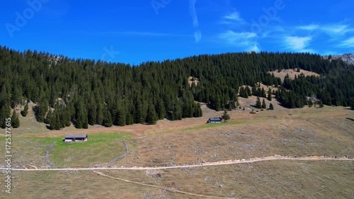 Cinematic 4K Aerial Drone video of flying over Brünnstein mountain in German Alps on a beautiful sunny summer day perfect for hiking with surrounding mountain peaks covered in ice and snow