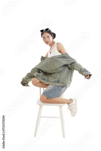 Photography Style Icon in Denim: A stylish individual, embodies effortless cool, striking a pose while draped in denim, capturing the essence of modern fashion