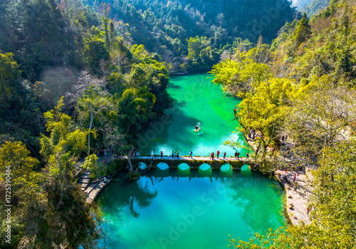 Aerial photography of the Xiaoqikong Bridge in Libo, Guizhou on a sunny day