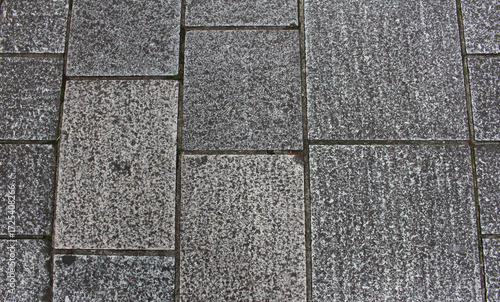 Wallpaper Mural Texture of gray and beige square paving tile. Pattern of sidewalk tiles in the street. Concrete pavers close up background.	 Torontodigital.ca