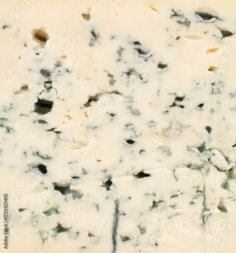 Blue cheese with holes, close-up.
