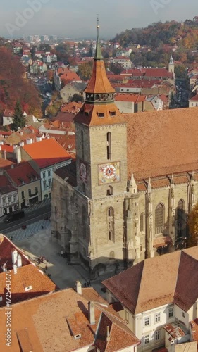 Wallpaper Mural Aerial view of Brasov old town with Black Church in autumn, Transylvania region, Romania. Vertical video Torontodigital.ca