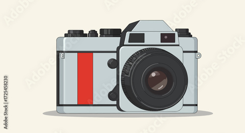 Vintage silver and red film camera with large lens.