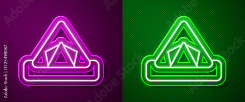 Glowing neon line Tourist tent icon isolated on purple and green background. Camping symbol. Vector