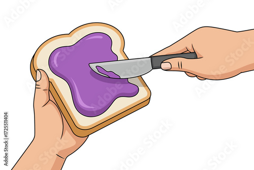 Spreading grape jelly on a slice of bread isolated on white background
