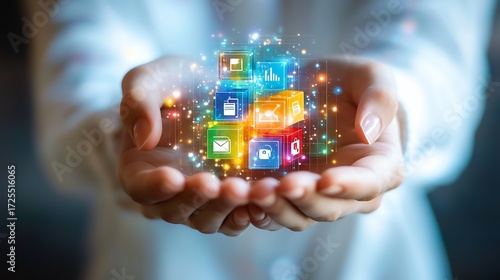Hands holding a colorful cube with app icons  Digital strategy concept