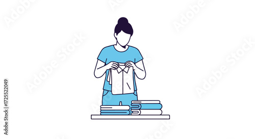 Faceless woman folding fresh clean laundry with precise and mindful movements for a neat and orderly stack with serene composure