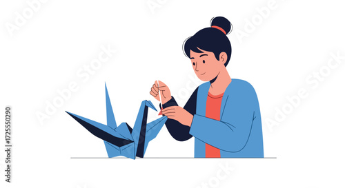 Young Woman Engaged in the Art of Origami, Meticulously Crafting a Traditional Paper Crane Symbolizing Peace and Longevity