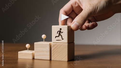 Hand building employee progress ladder wood cubes