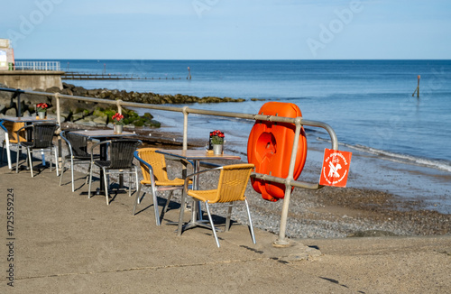 Alfresco dining. Outdoor tables and chairs overlooking the Norfolk Coast