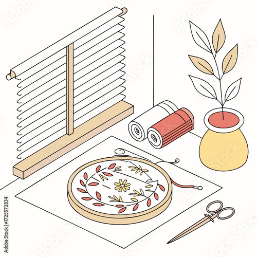 Embroidery supplies and home decor elements on a table