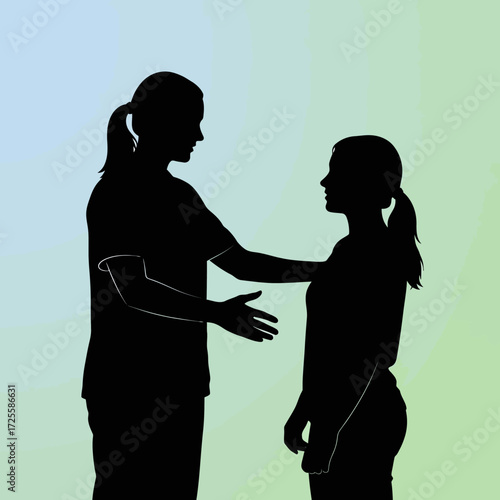 Empathetic mentor guides younger colleague with supportive gesture and encouraging conversation in a modern, bright setting.