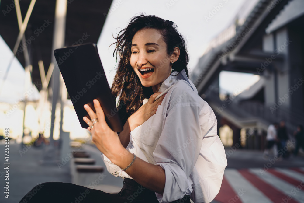 © BullRun - Excited freelancer reacting to news on digital tablet outdoors. Conceptual portrait symbolizing empowerment, creativity, modern professional independence, and technology-driven opportunities. © BullRun - Excited freelancer reacting to news on digital tablet outdoors. Conceptual portrait symbolizing empowerment, creativity, modern professional independence, and technology-driven opportunities.