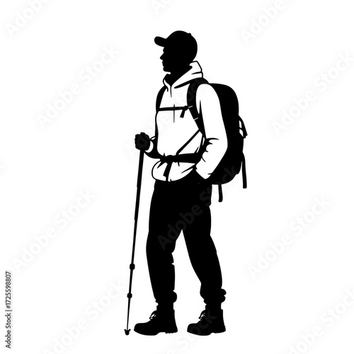 Hiker preparing for an adventure in the mountains during the early morning hours