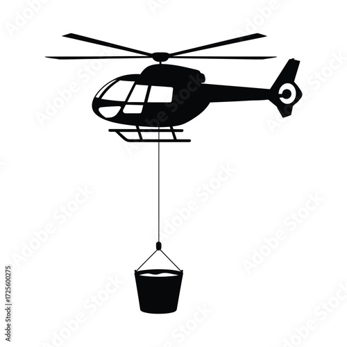 Silhouette of a helicopter carrying a water bucket for firefighting operations