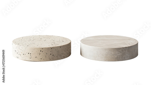 Two circular concrete objects. one with a speckled texture and the other smooth. displayed side by side on a white background. different finishes for design purposes