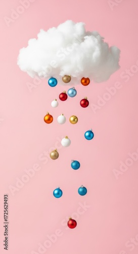 A fluffy white cloud raining colorful Christmas ornaments on a pink background.