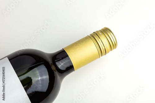 Elegant Wine Bottle With Gold Foil Screw Cap Close-Up On White Background 