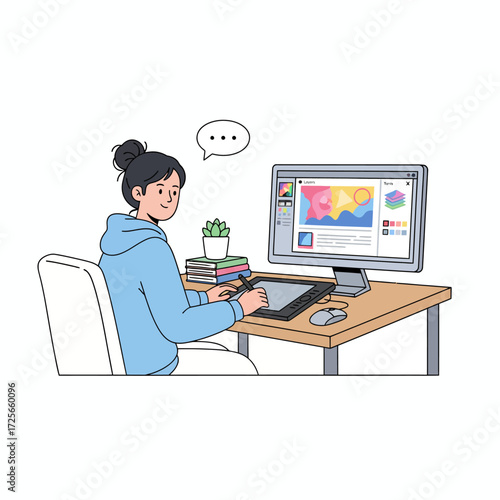 A female graphic designer or digital artist drawing on a graphic tablet connected to her computer.