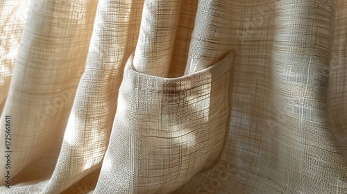 Close-up of a beige fabric with a pocket