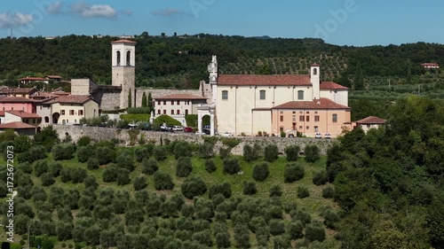 Wallpaper Mural Aerial view of Chiesa Parrocchiale della Natività della Madonna and Castello di Polpenazze on Lake Garda, Italy. Historic medieval castle and fortress captured in 4K drone footage. Torontodigital.ca