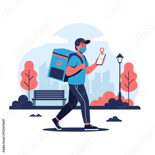 A delivery person wearing a mask and carrying a large insulated bag walks down a park path while looking at their phone.