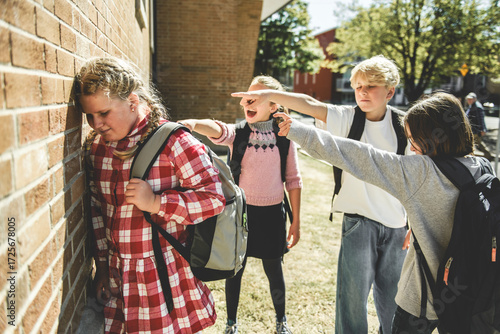 sad girl Bullying in Schoolyard with other student have some intimidation attitude