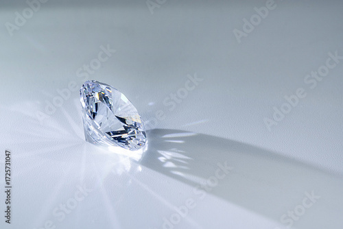 Close up of a clear pear cut diamond gemstone sparkling with brilliance on white background. Ideal for jewelry, luxury design, wealth, wedding, engagement, and elegant decoration concepts.