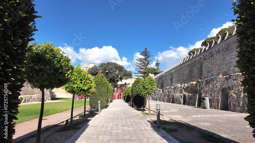 Gardens with manicured greenery and fortified stone walls in Rabat, Malta