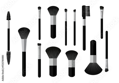 Blackgrey makeup brushes of various sizesshapes with grey handles isolated against a white background