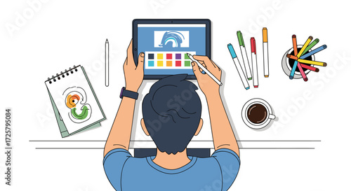 Graphic designer working on a tablet with color palette and art supplies